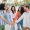 Meeting of smiling young adult people, men and women stacking hands showing unity or support enjoying together outside. Group of cheerful best friends community having fun cooperating together. Team. High quality photo